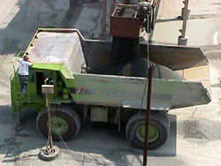 Photo showing crushed stone being loaded into a hauler