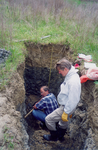 Soil pit being described at a monitoring site.